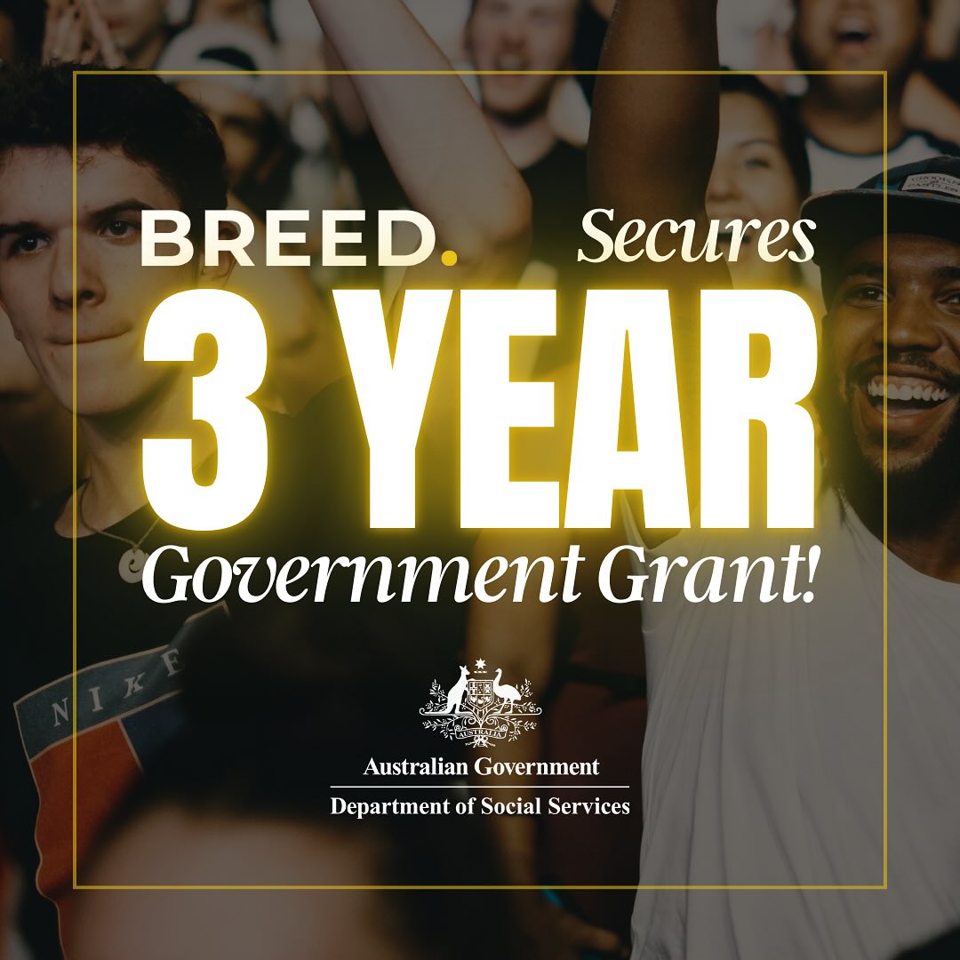 Group of people celebrating with text: "BREED secures 3 year Government Grant!" Australian Government Department of Social Services logo at the bottom.